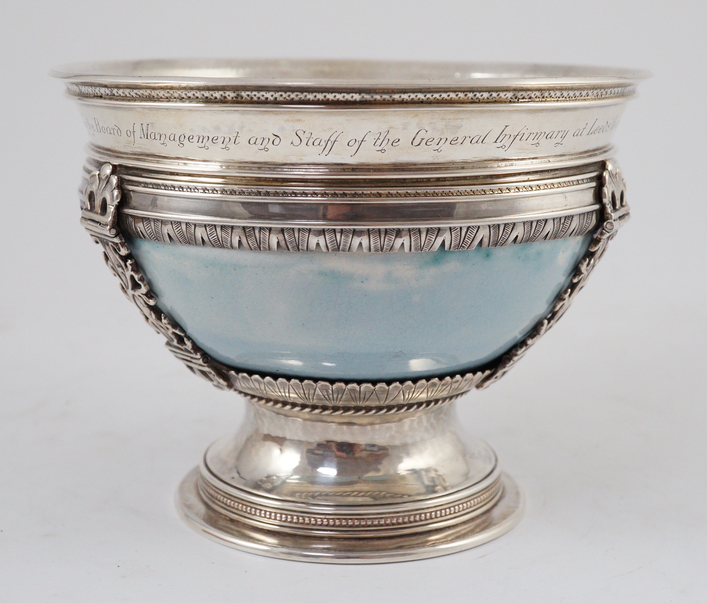 An Arts and Crafts silver mounted Ruskin pottery pedestal bowl, the silver mounts by A.E. Jones, Birmingham 1929, 16.5cm diameter